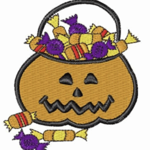 Halloween pumpkin basket overflowing with candy, including taffy and wrapped sweets.