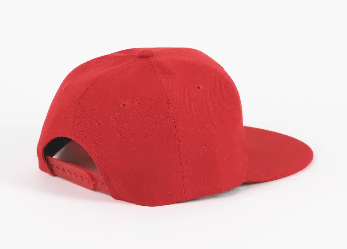 Back view of a plain red snapback hat.